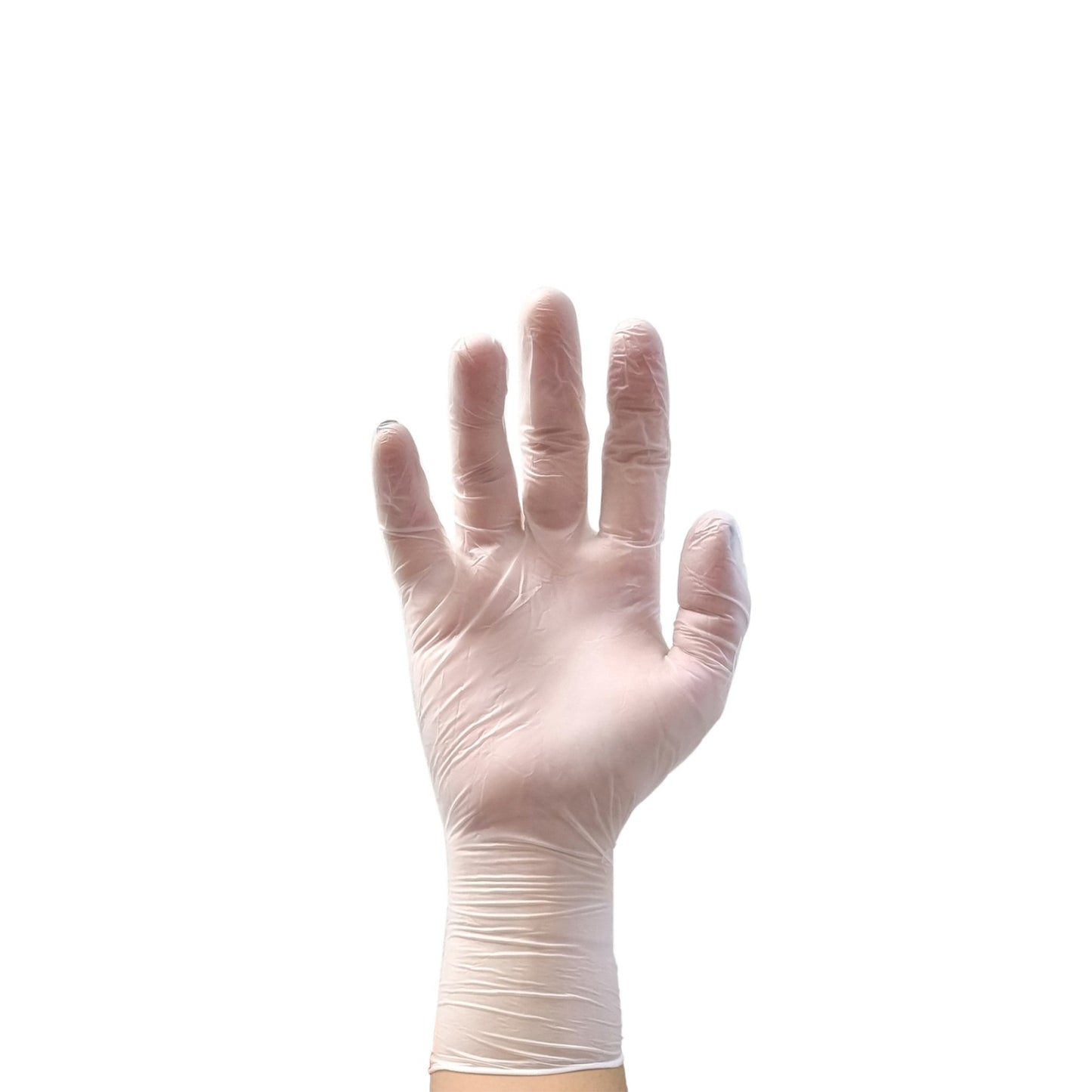 Manos utilizando guantes de vinilo Tresor para la manipulación higiénica de vegetales en una cocina profesional.