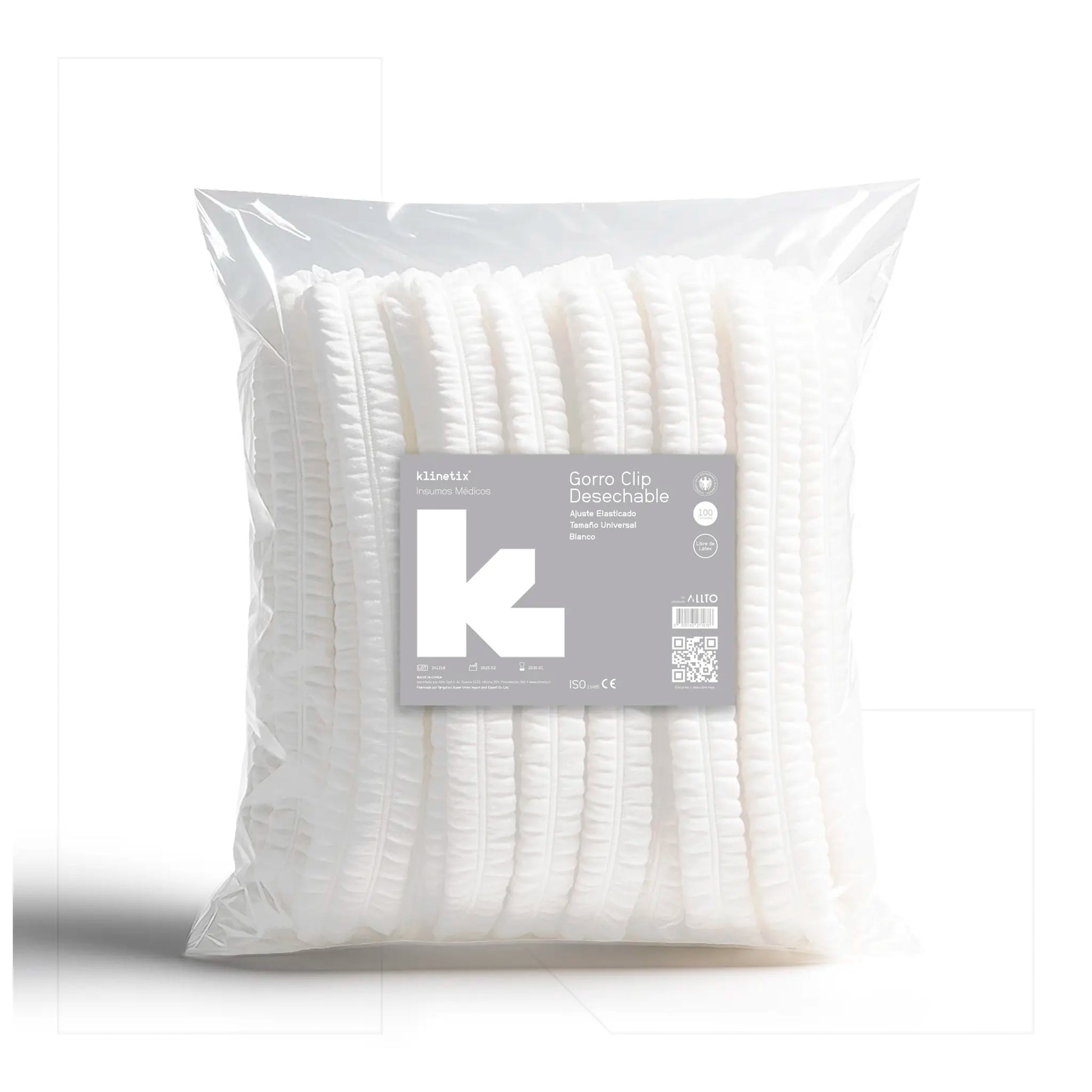Bolsa transparente de 100 unidades de cofias desechables Klinetix tipo clip en color blanco, fabricadas en polipropileno para higiene industrial y médica.