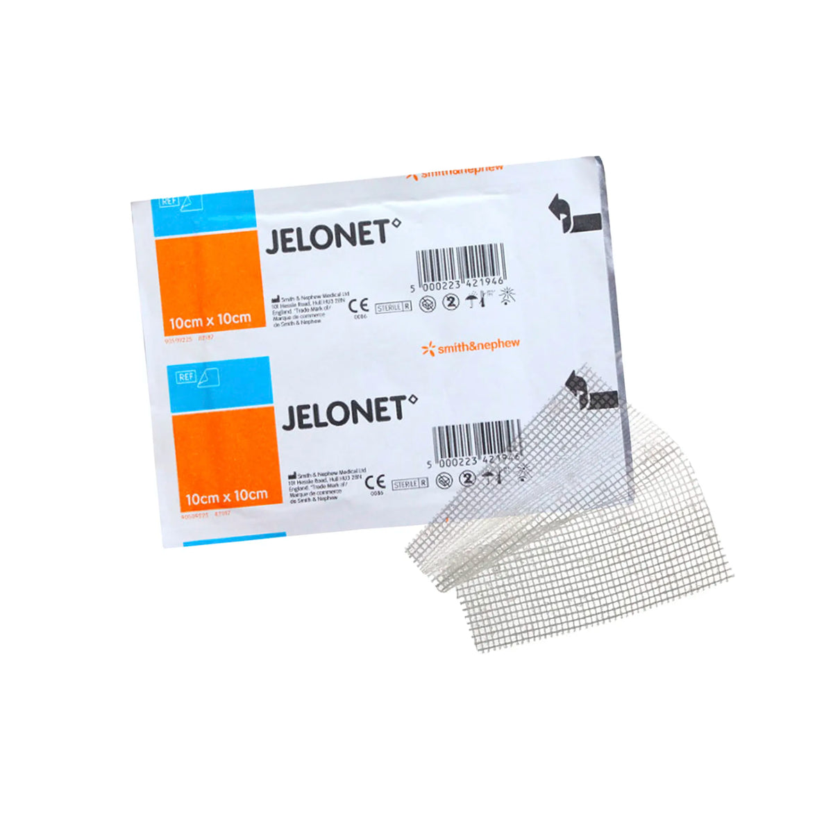 Apósito de gasa parafinada Jelonet de 10 x 10 cm en su empaque individual blanco y naranja. Malla de tejido abierto impregnada con parafina para un retiro atraumático de heridas. Distribuido por Klinetix.