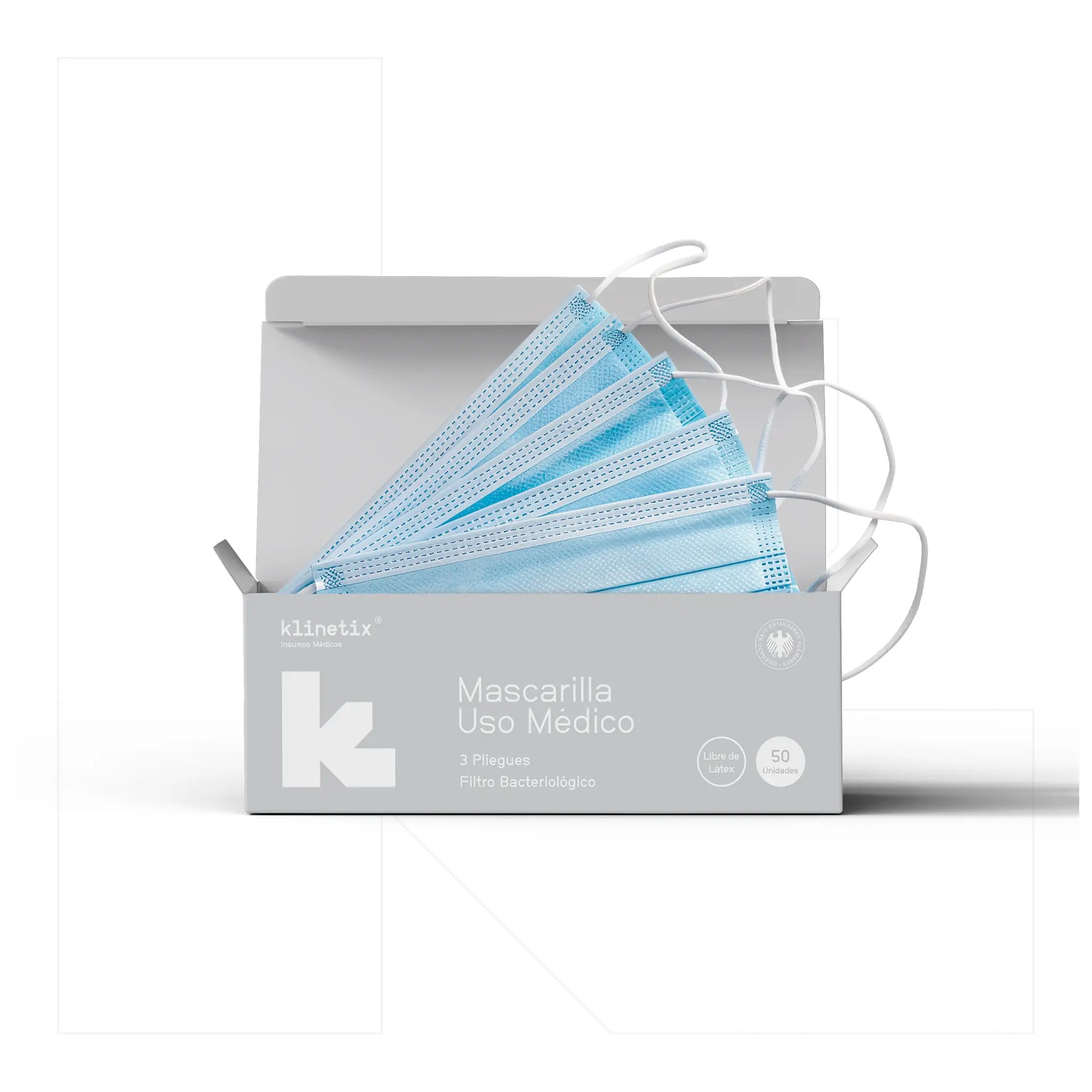 Caja dispensadora abierta mostrando las mascarillas desechables Klinetix, diseñadas para facilitar el retiro individual en clínicas, oficinas y uso cotidiano.